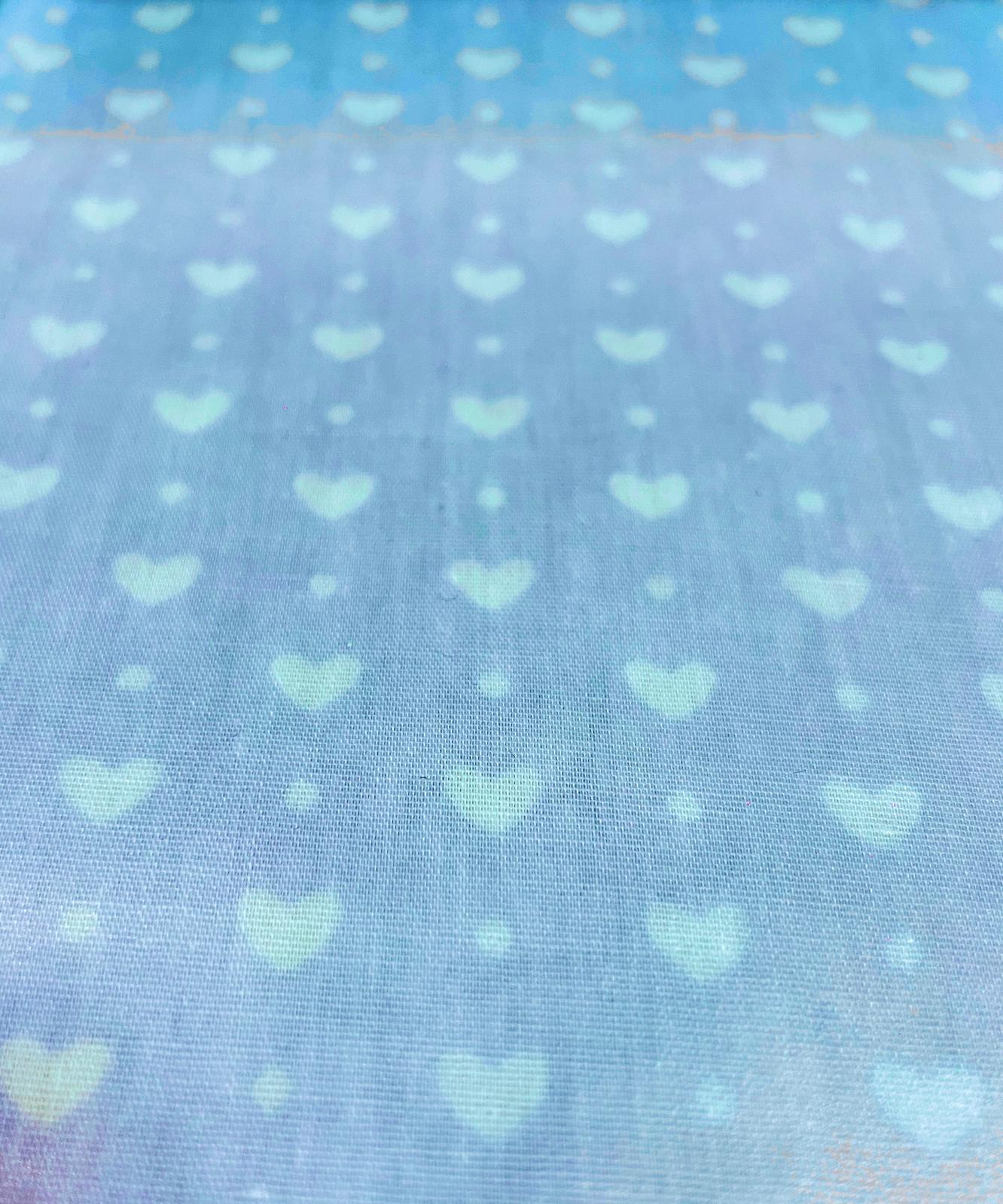 Beschichtete Baumwolle "Himmelsliebe" hellblau mit weißen Herzen